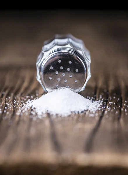 Salt Shaker  on vintage wooden table — Stock Photo, Image