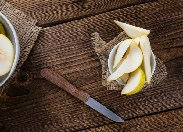 Pears on an old wooden table — Stock Photo, Image