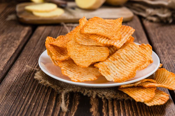 Del av veckade potatischips — Stockfoto