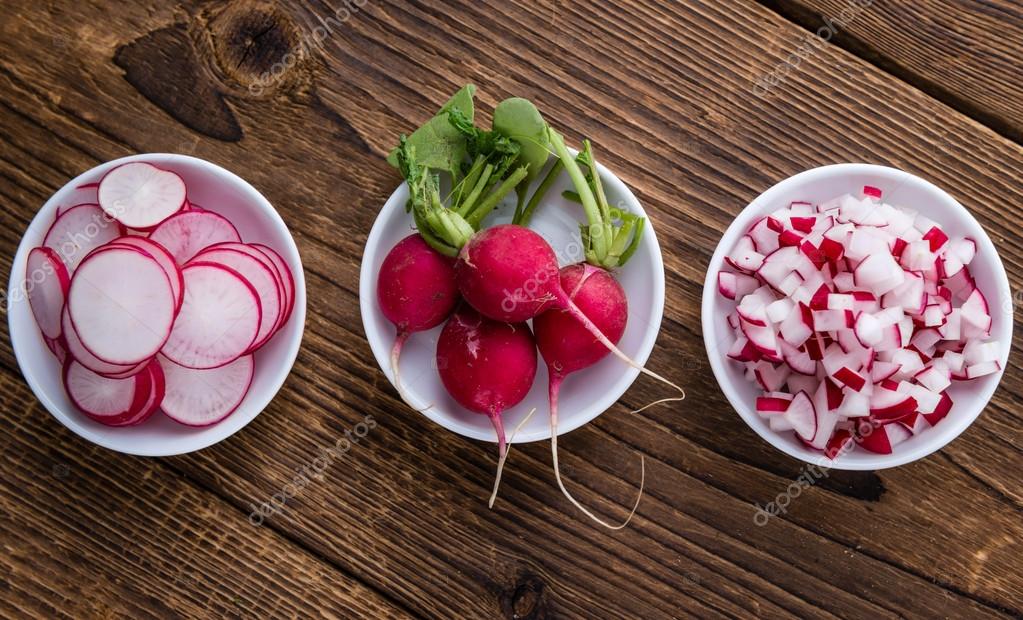 Radishes, whole, sliced and diced — Stock Photo © HandmadePicture 105584488