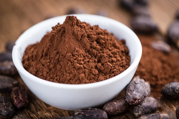 Cocoa powder in bowl — Stock Photo, Image