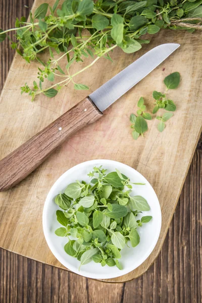 Fresh Oregano on wooden table — Stock Photo, Image