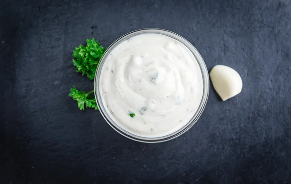 Portion of Garlic Sauce on a slate slab — Stock Photo, Image