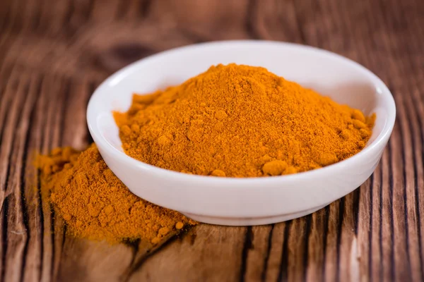 Heap of Turmeric on table — Stock Photo, Image