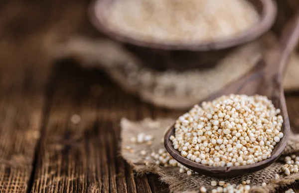 Table with a portion of puffed Quinoa — Stock Photo, Image