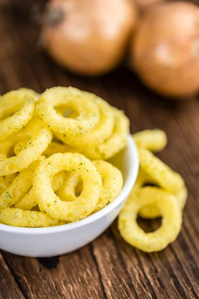 Onion Rings on wooden background — Stock Photo, Image