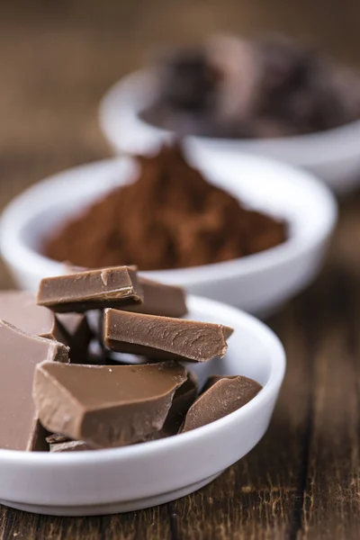 Milk Chocolate on wooden background — Stock Photo, Image