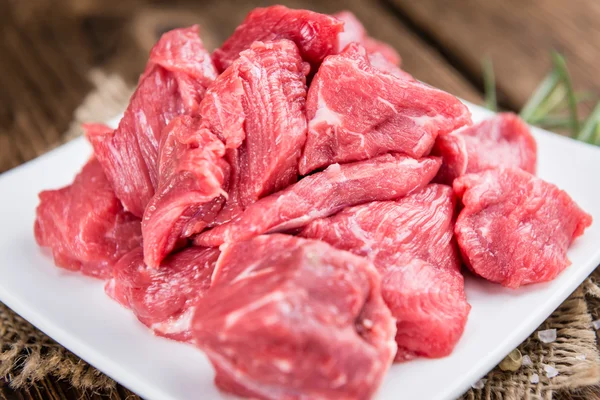Wooden table with Chopped Beef fillets — Stock Photo, Image