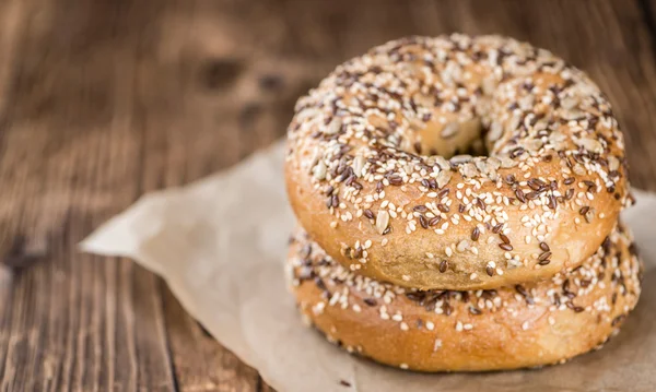 Wholemeal Bagels on wooden background — Stock Photo, Image