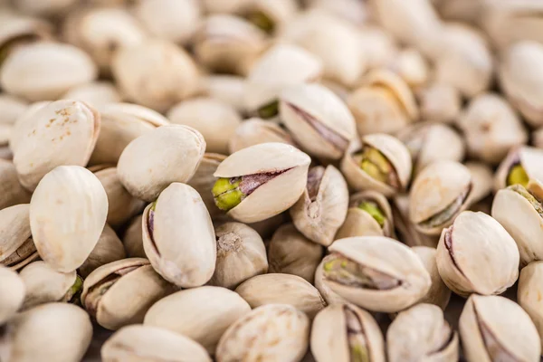 Whole Pistachios  on wooden background — Stock Photo, Image