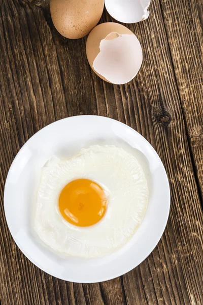 Fried Egg on wooden background — Stock Photo, Image