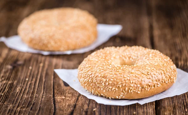 Sesame Bagels on wooden table — Stock Photo, Image