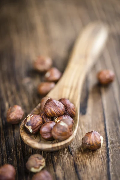 Hazelnuts on wooden spoon — Stock Photo, Image