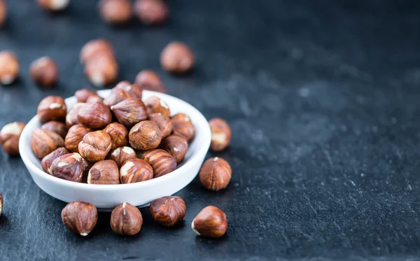 Dried Hazelnuts in bowl — Stock Photo, Image