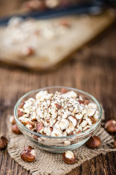 Cutted Hazelnuts in bowl — Stock Photo, Image