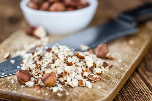 Table with chopped Hazelnuts — Stock Photo, Image