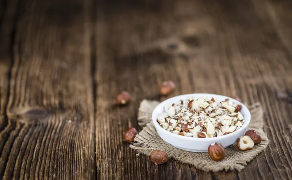 Cutted Hazelnuts in bowl — Stock Photo, Image