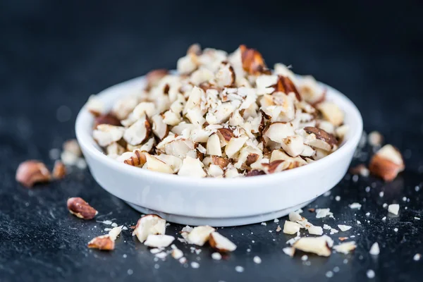 Cutted Hazelnuts in bowl — Stock Photo, Image