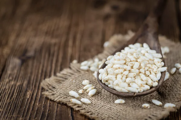 Old wooden table with puffed Rice — Stock Photo, Image