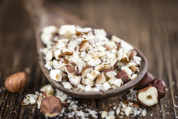 Chopped Hazelnuts on vintage background — Stock Photo, Image