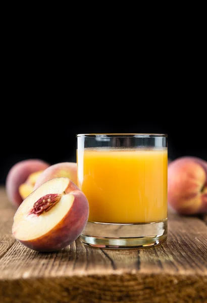 Peach juice on table — Stock Photo, Image