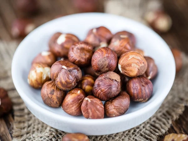 Hazelnuts on wooden table — Stock Photo, Image