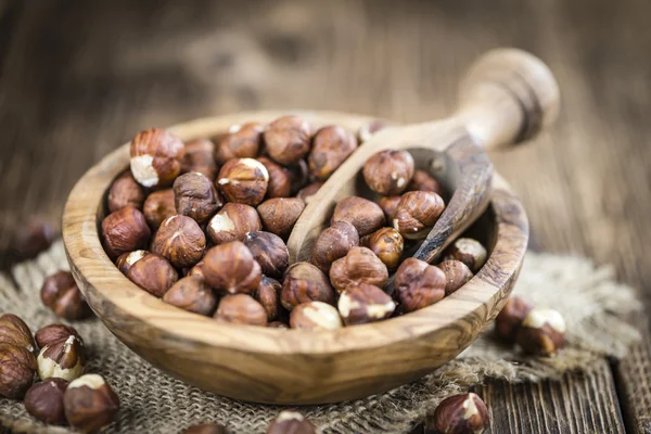 Portion of Hazelnuts on table — Stock Photo, Image