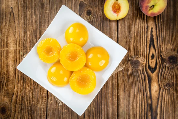 Peaches  on wooden background