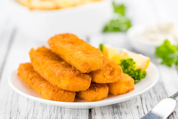 Fisch Sticks on an old wooden table — Stock Photo, Image