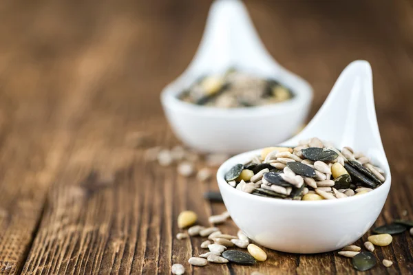 Mixed Seeds on wooden background — Stock Photo, Image