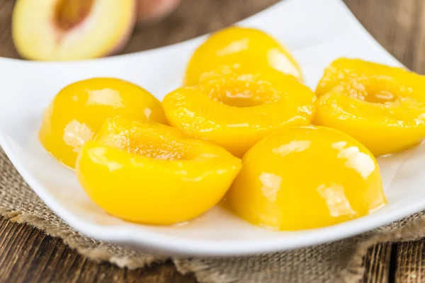 Peaches on vintage wooden background