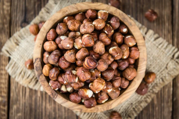 Hazelnuts on vintage wooden background — Stock Photo, Image