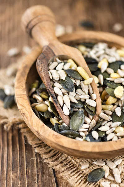 Mixed Seeds on wooden background — Stock Photo, Image