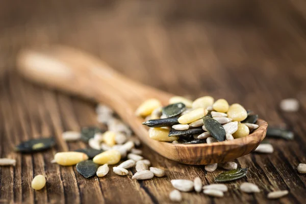 Old wooden table with mixed Seeds — Stock Photo, Image