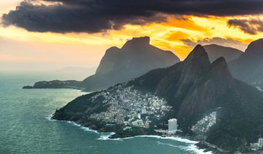 Favela Vidigal in Rio de Janeiro during sunset, aerial shot from a helicotper clipart