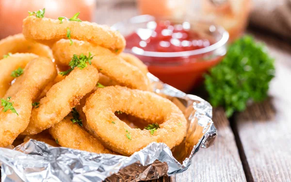 Fresh made Onion Rings on table — Stock Photo, Image