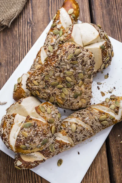 Pretzel Rolls with mixed Seeds — Stock Photo, Image