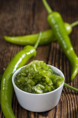 Green Chilies in olive oil clipart