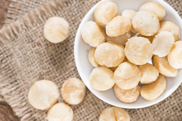 Macadamia nuts on plate — Stock Photo, Image