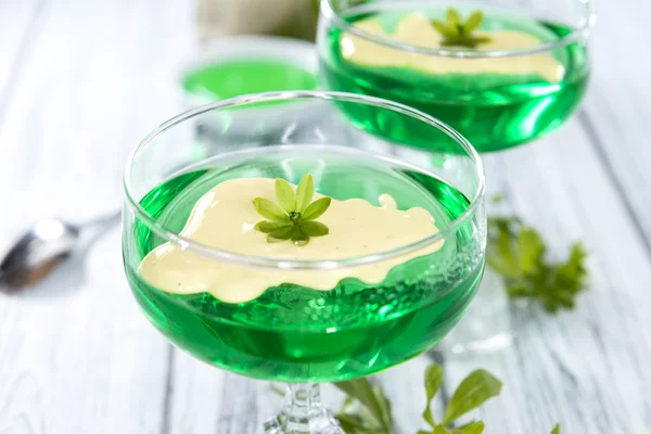 Woodruff Jelly with Vanilla Sauce in glasses — Stock Photo, Image