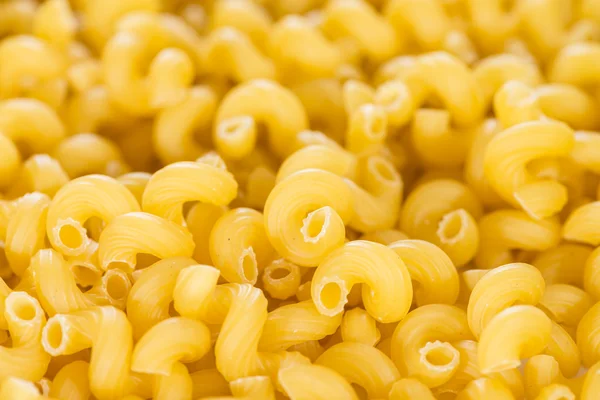 Pasta rizos fondo imagen — Foto de Stock