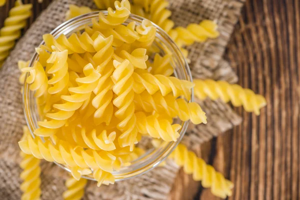 Uncooked Fussili in bowl — Stock Photo, Image