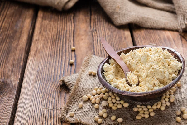 Heap of Soy Flour in wooden bowl — Stock Photo, Image