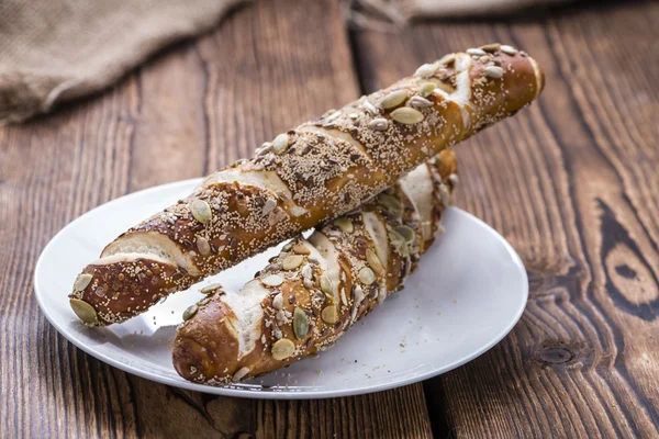 Fresh baked Pretzel Rolls with seeds — Stock Photo, Image