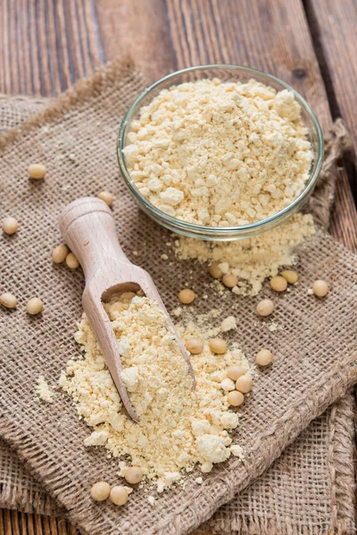 Portion de farine de soja sur cuillère et dans un bol — Photo