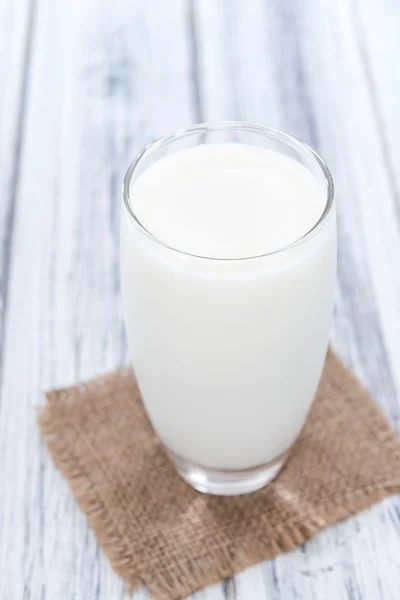 Portion of Milk on wood — Stockfoto