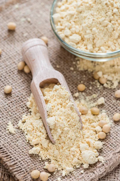 Portion of Soy Flour on spoon and in bowl — Stock Photo, Image