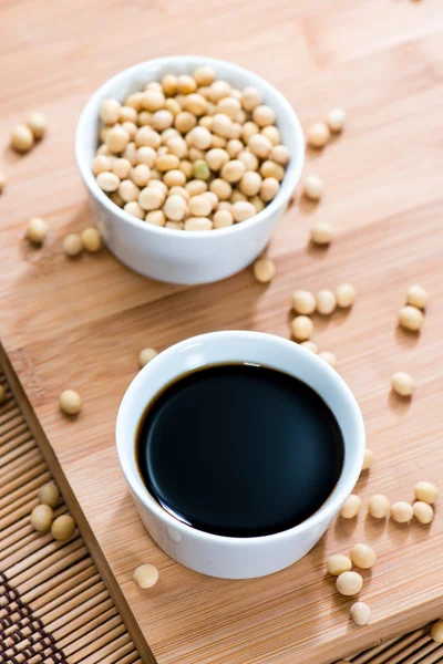 Portion of Soy Sauce and soy beans Royalty Free Stock Images