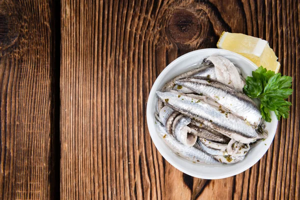 Pickled Anchovis with herbs — Stock Image Pickled Anchovis with herbs Royalty Free Stock Photos