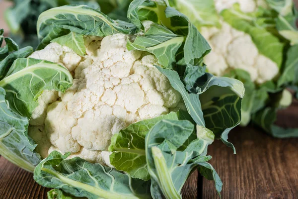 Cauliflower on a rustic wooden table — Stock Photo, Image